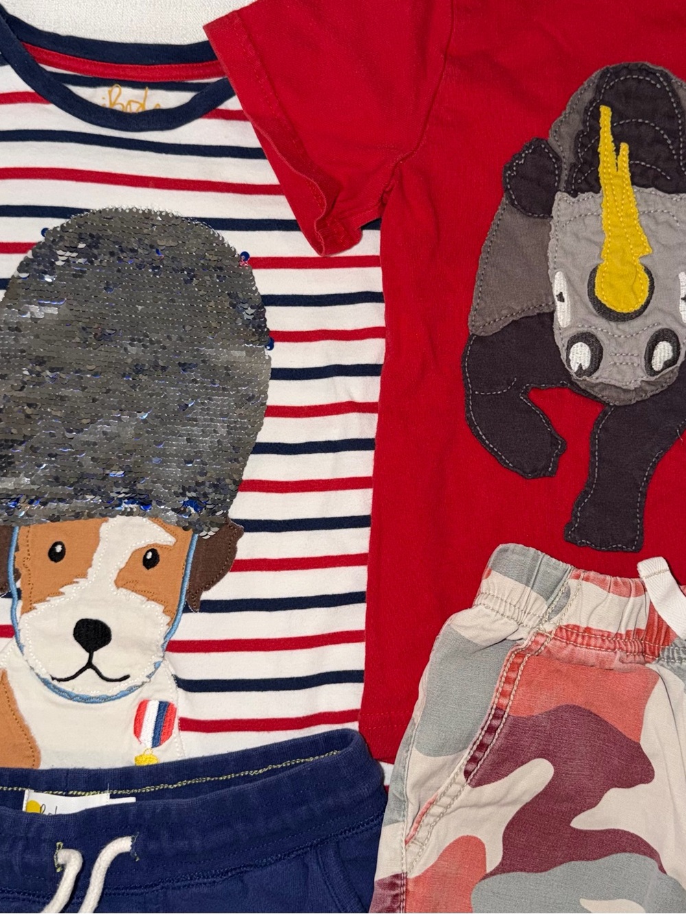 Two Mini Boden appliqué T-shirts, and two pair of shorts size 5/6